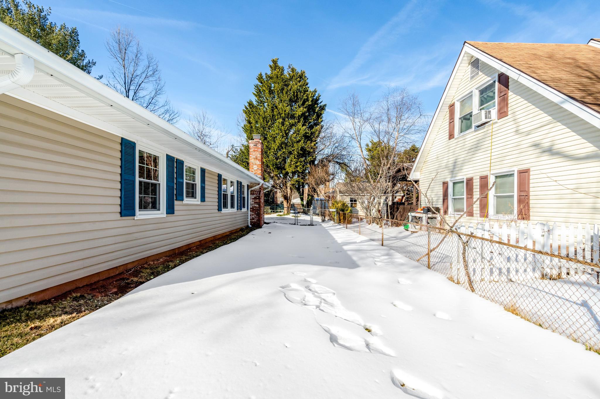 13128 Moss Ranch Lane Fairfax, VA 22033 - Photo 51 of 56 a view of a house with a snow on the road
