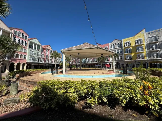 a view of a building with a yard