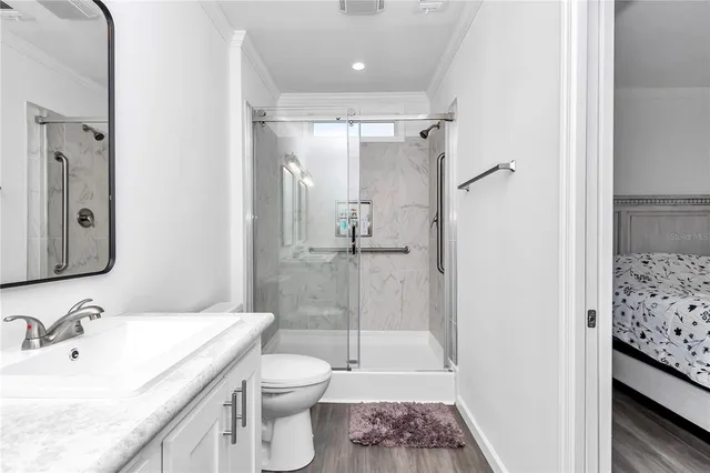 a view of a room with lots of chairs and wooden floor
