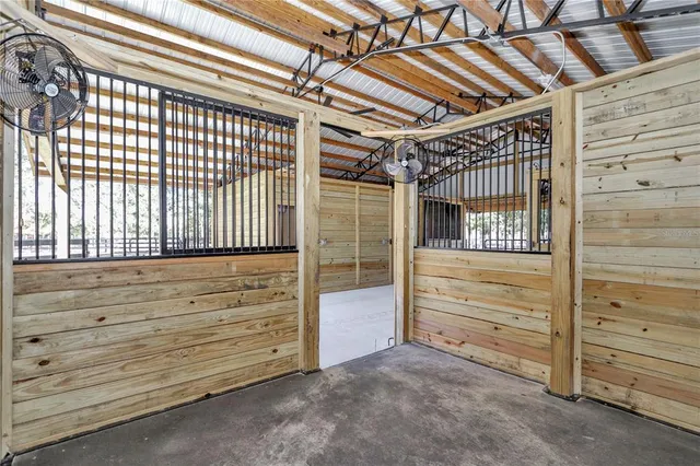 a view of swimming pool with a lounge chairs