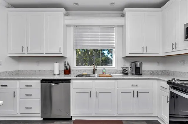 a large kitchen with a table and chairs