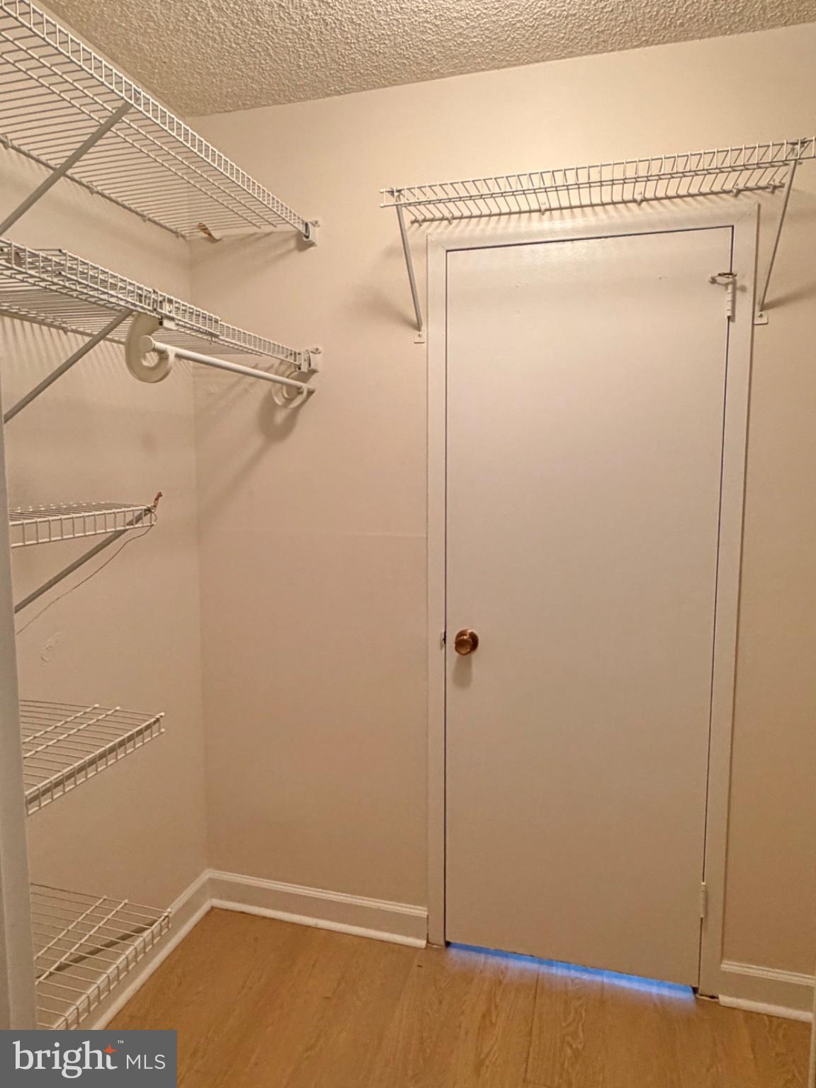 5225 Pooks Hill Road, Unit 303S Bethesda, MD 20814 - Photo 12 of 19 Spacious closet with organized shelving.