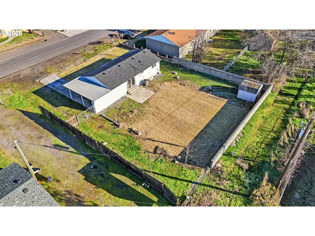 an aerial view of residential building and lake