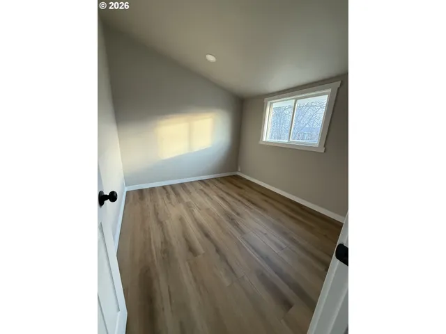 a view of an empty room with a window