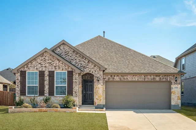 front view of a house with yard