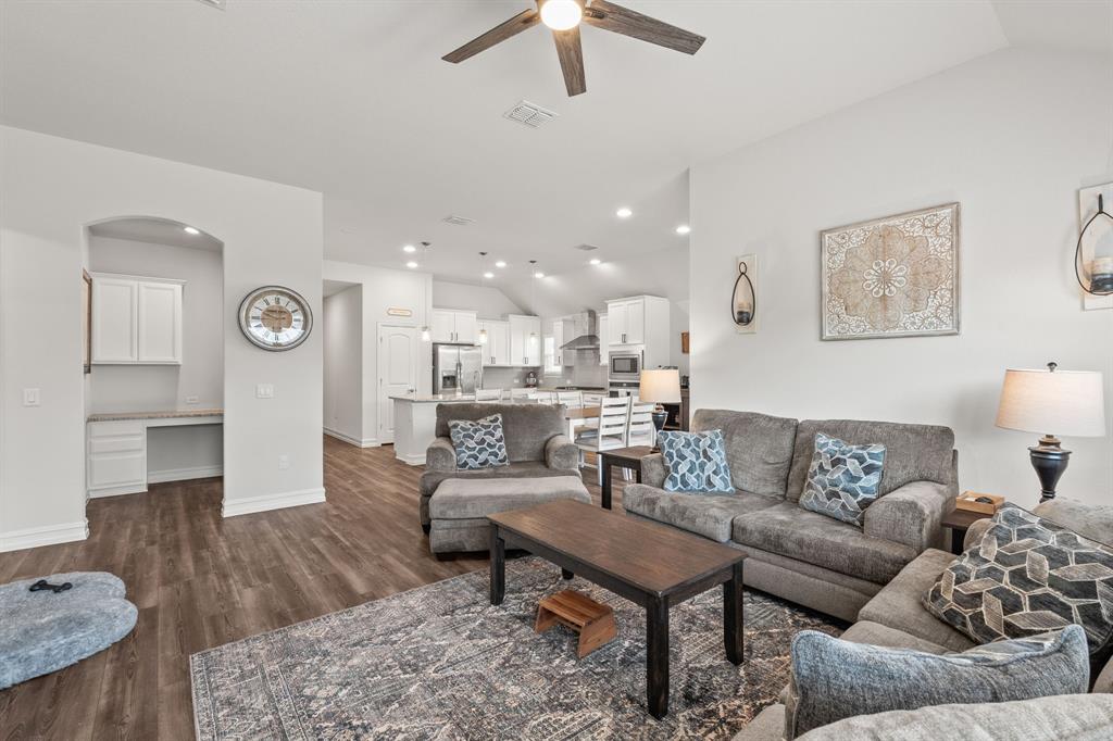 2920 Arlo Road Aubrey, TX 76227 - Photo 11 of 31 a living room with furniture and a wooden floor