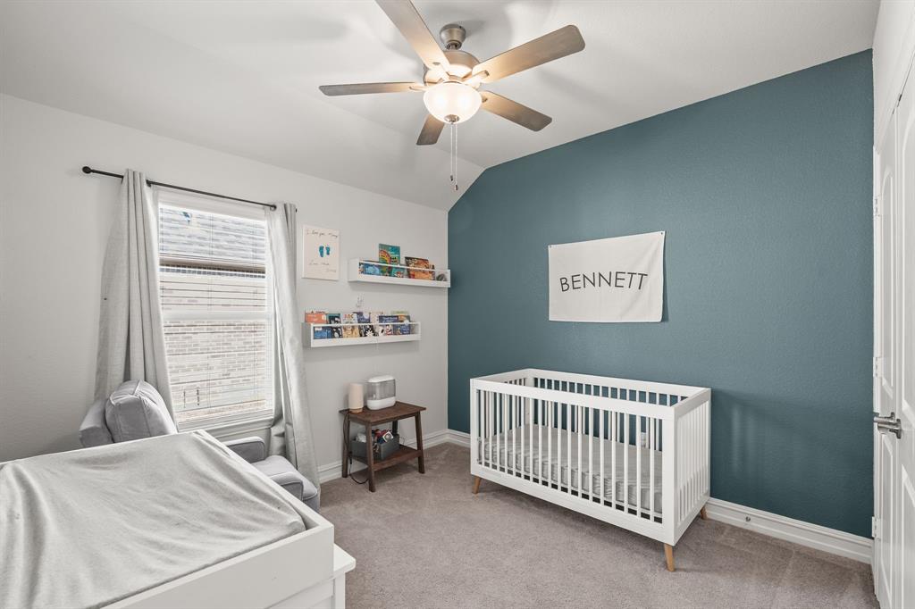2920 Arlo Road Aubrey, TX 76227 - Photo 17 of 31 a bedroom with a bed and a window