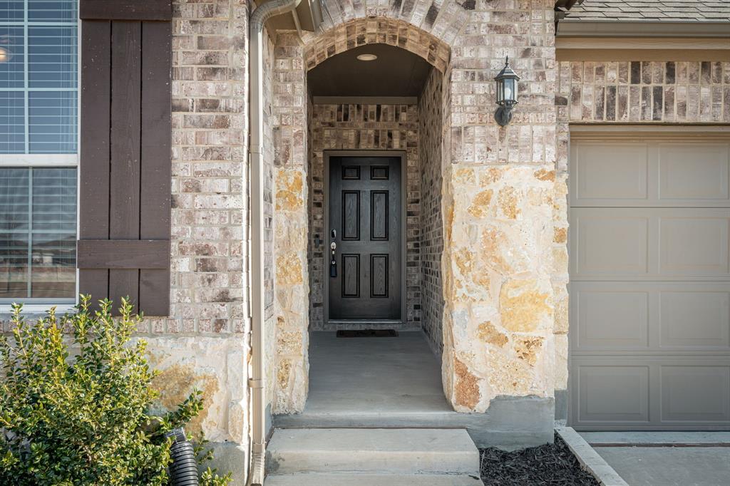 2920 Arlo Road Aubrey, TX 76227 - Photo 2 of 31 a front view of a house with a balcony