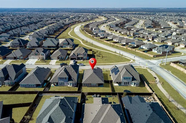a aerial view of a house with a yard