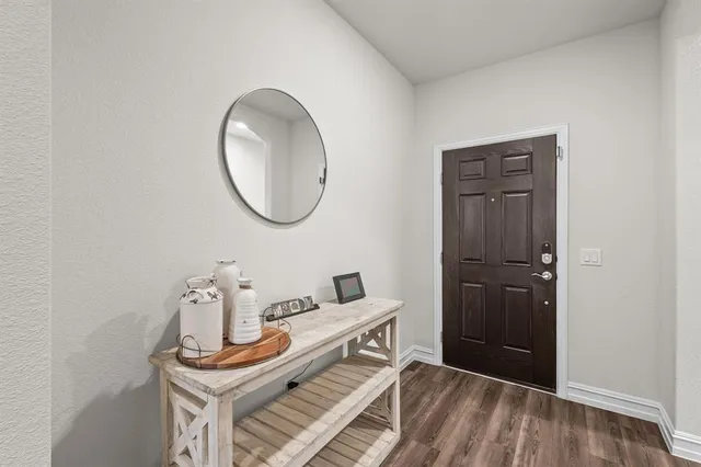 a room with a table and a mirror