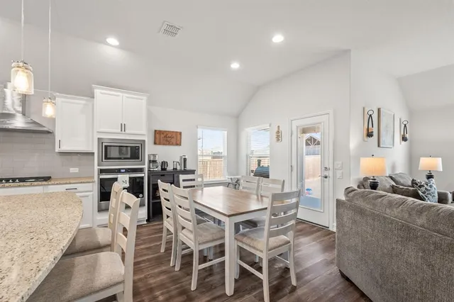 a view of a dining room with furniture