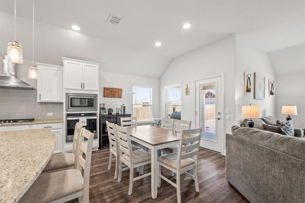 2920 Arlo Road Aubrey, TX 76227 - Photo 7 of 31 a view of a dining room with furniture