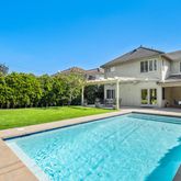 a front view of a house with a yard table and chairs