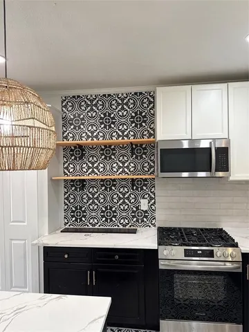 a bedroom with a bed a window and dresser