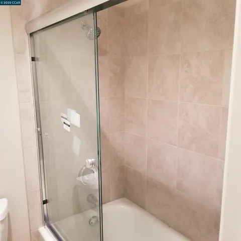 a kitchen with a window a sink and a stove