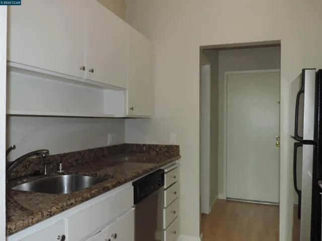 a view of a room with yard from balcony