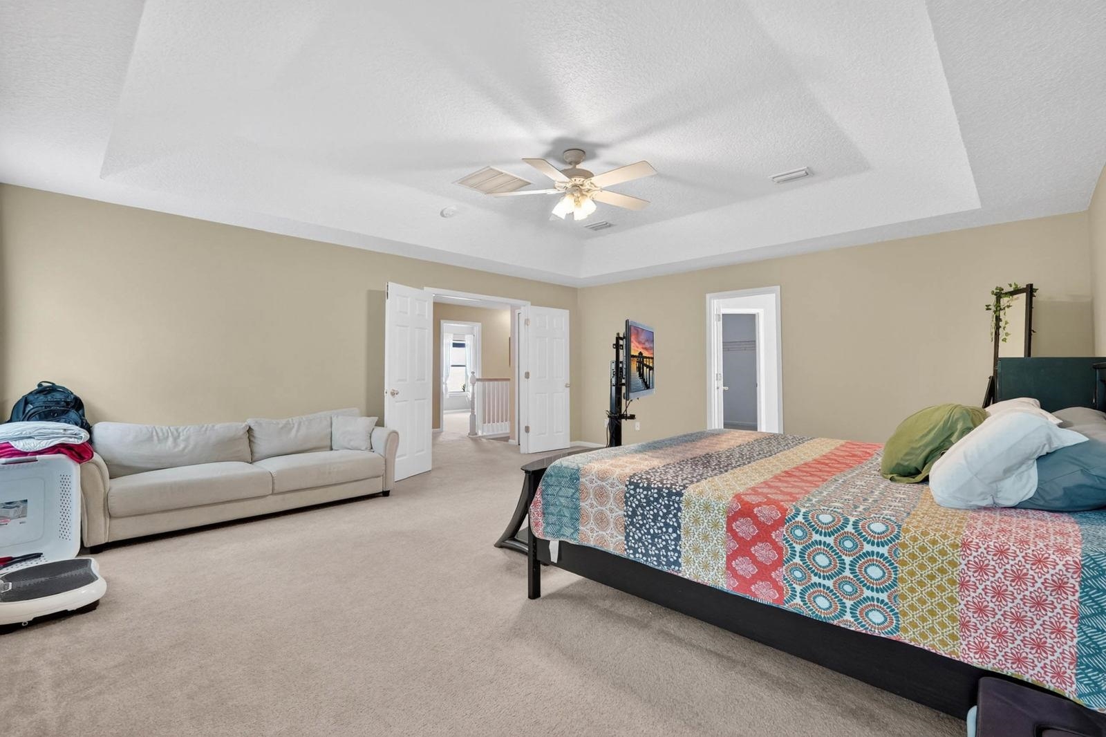 1237 Splendid Ravine Street St. Augustine, FL 32092 - Photo 27 of 62 a bedroom with a bed couch and a ceiling fan