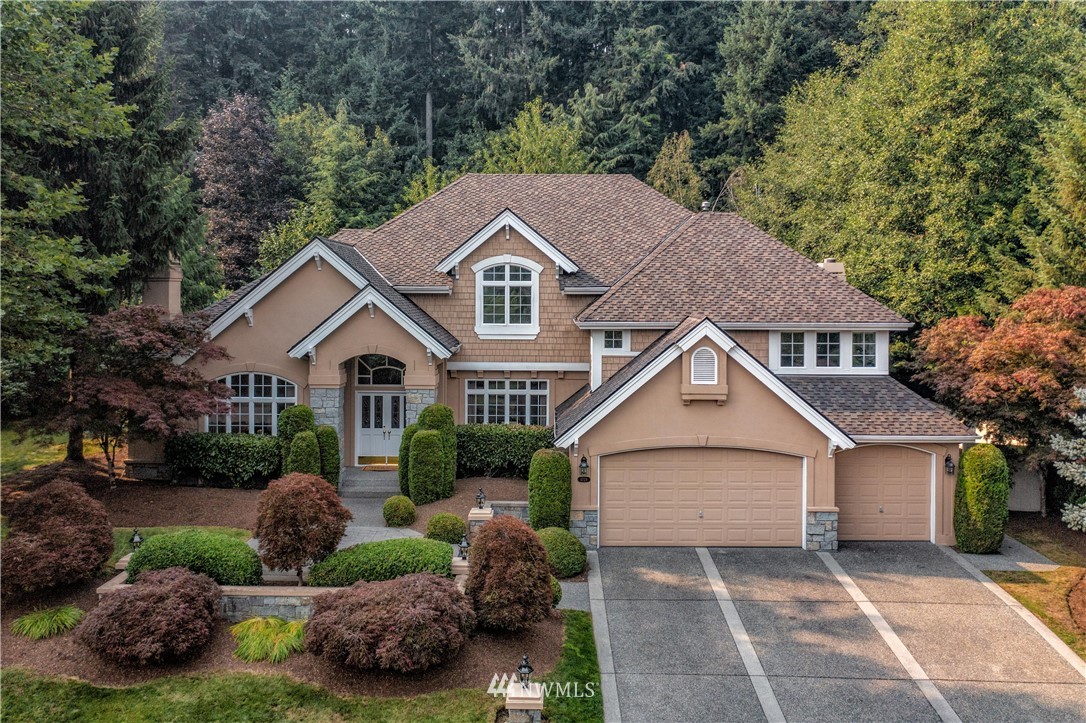 4729 176th Street Southeast Bothell, WA 98012 - Photo 1 of 40 a front view of a house with a garden and plants