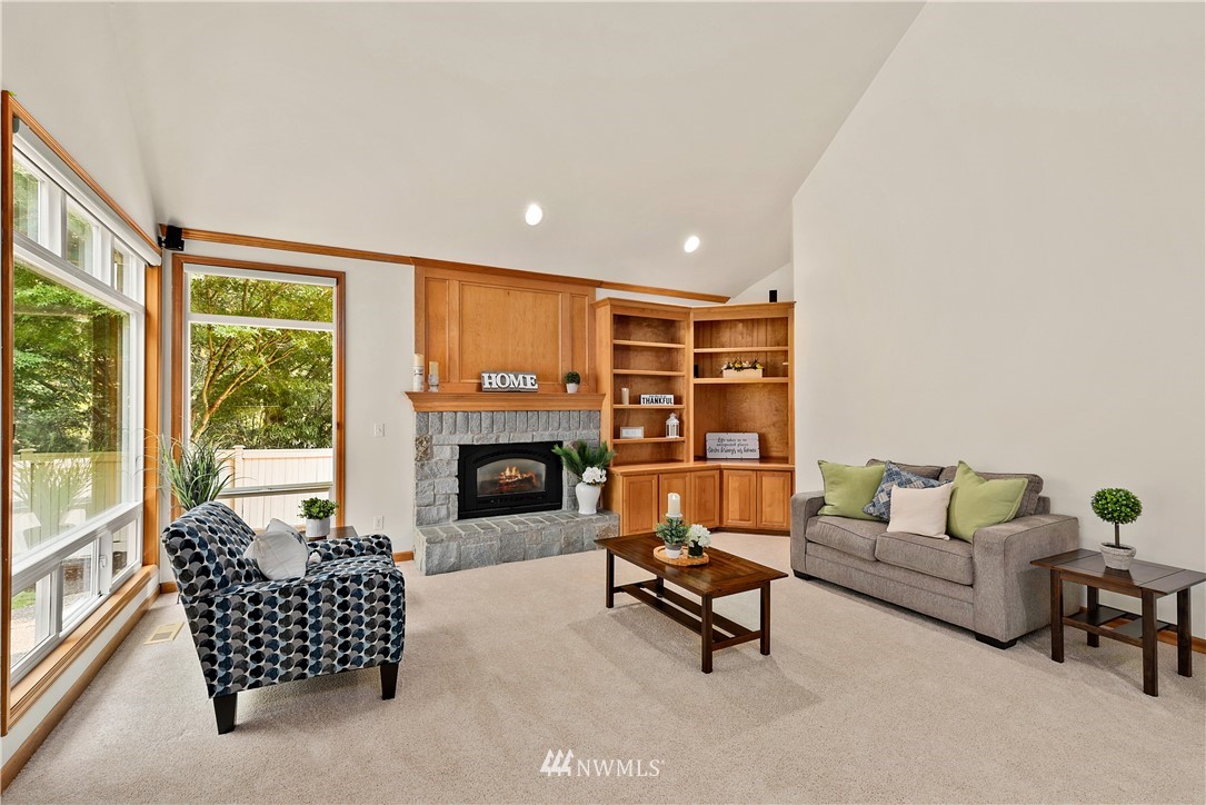 4729 176th Street Southeast Bothell, WA 98012 - Photo 15 of 40 a living room with furniture and a fireplace