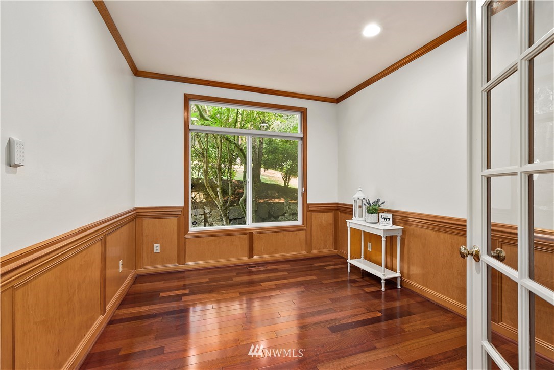 4729 176th Street Southeast Bothell, WA 98012 - Photo 16 of 40 a view of empty room with wooden floor and fan