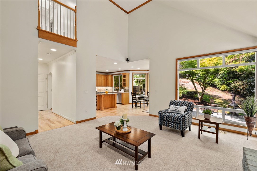 4729 176th Street Southeast Bothell, WA 98012 - Photo 23 of 40 a living room with furniture and a floor to ceiling window