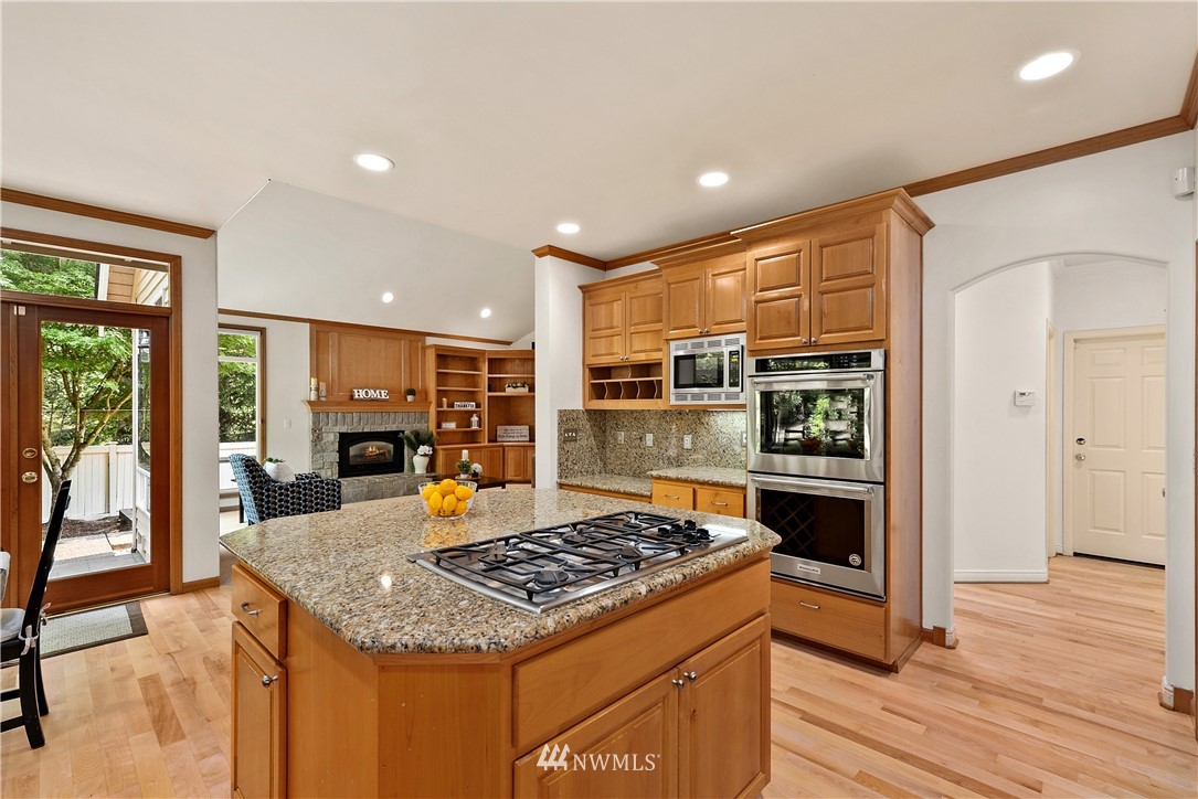 4729 176th Street Southeast Bothell, WA 98012 - Photo 25 of 40 a kitchen with stainless steel appliances granite countertop a stove and a refrigerator