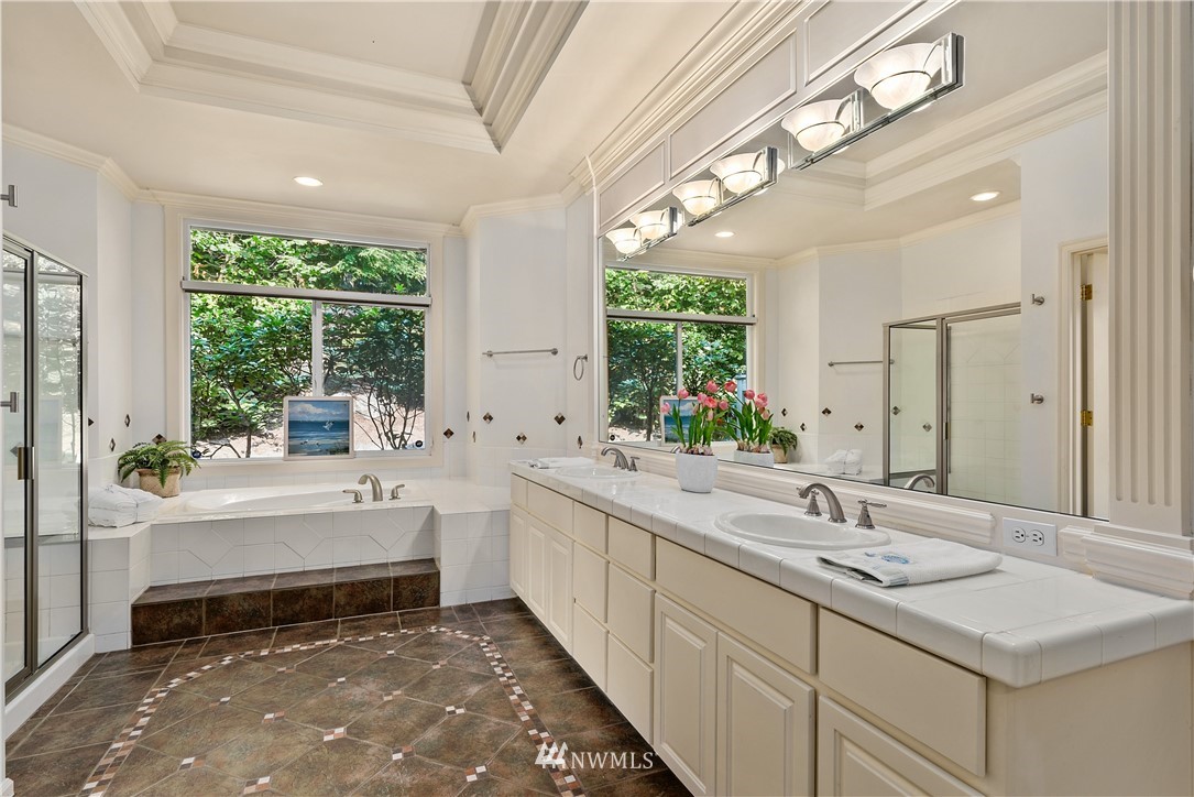 4729 176th Street Southeast Bothell, WA 98012 - Photo 28 of 40 a bathroom with a tub sink and mirror