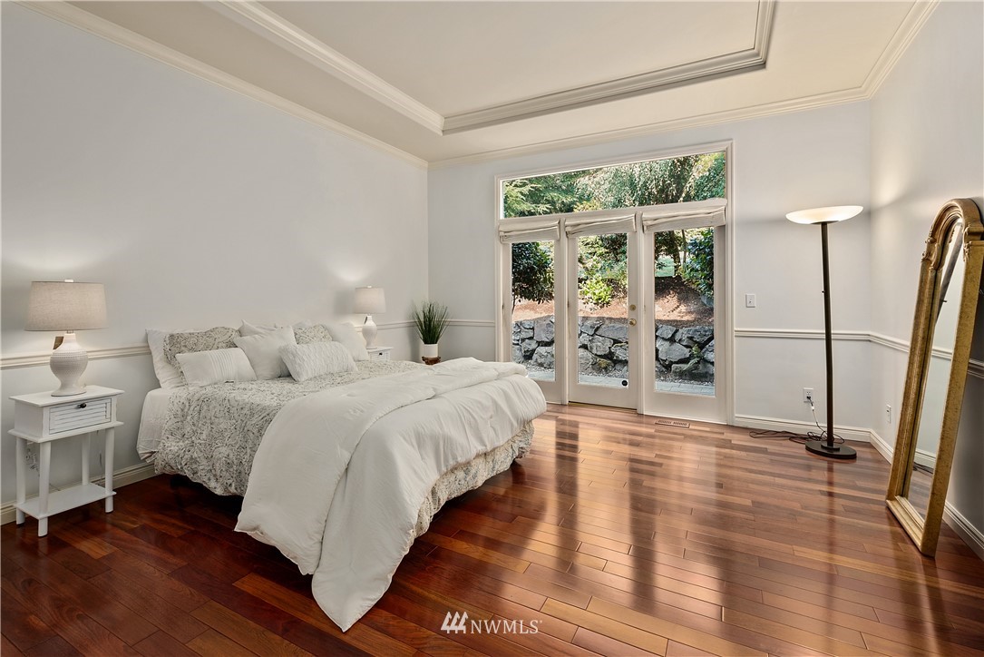 4729 176th Street Southeast Bothell, WA 98012 - Photo 30 of 40 a spacious bedroom with a bed and a table