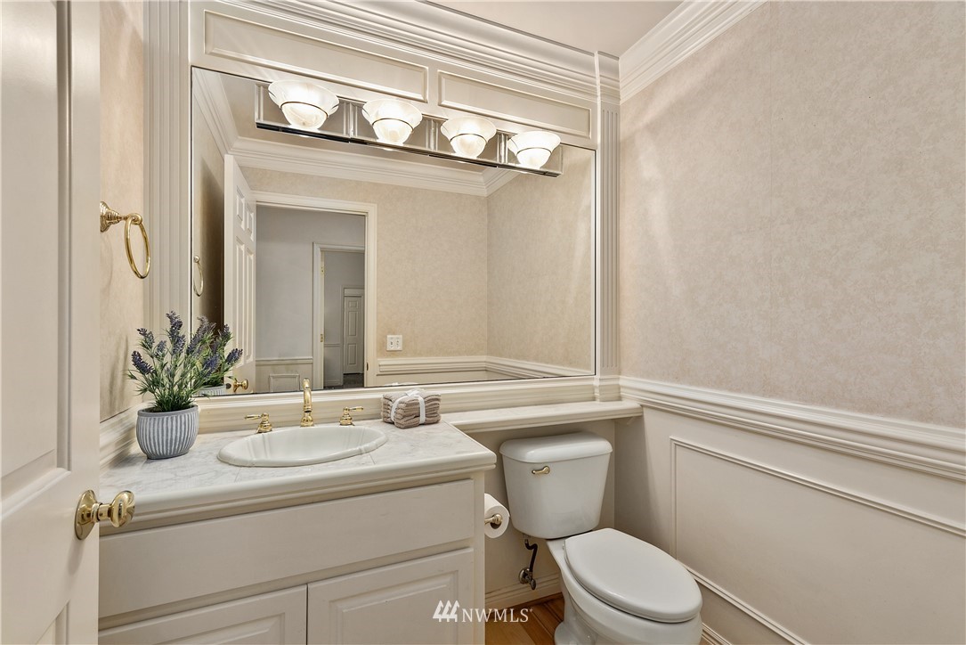 4729 176th Street Southeast Bothell, WA 98012 - Photo 33 of 40 a bathroom with a toilet a sink and a mirror