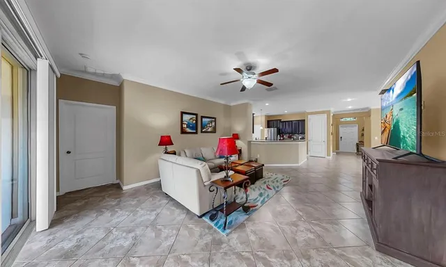 a bedroom with a bed lamps and a potted plant