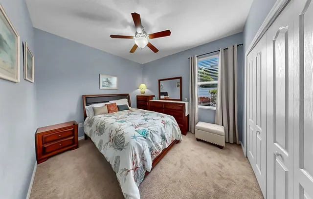 a view of a house with a big yard and potted plants