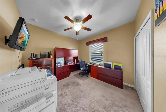 an aerial view of multiple houses with a yard