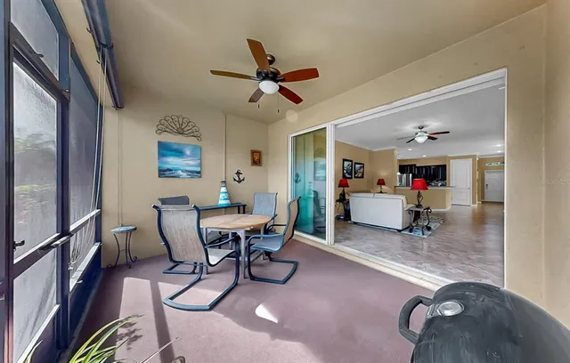 a aerial view of a house with swimming pool and outdoor seating