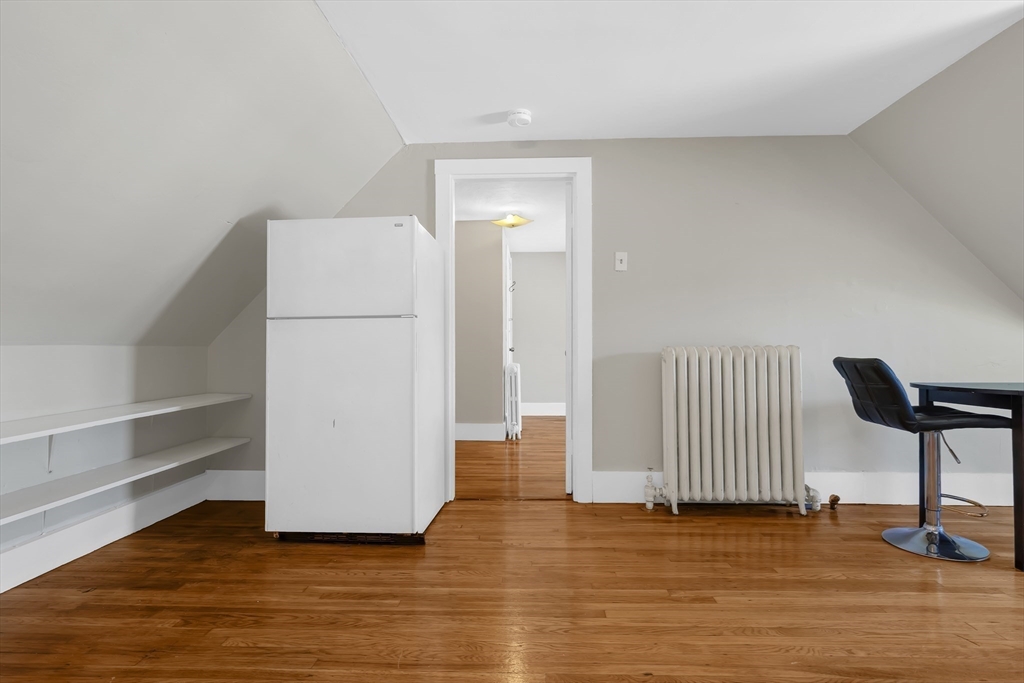28 Evergreen Street, Unit 3 Boston, MA 02130 - Photo 7 of 16 a view of a room with wooden floor and chair