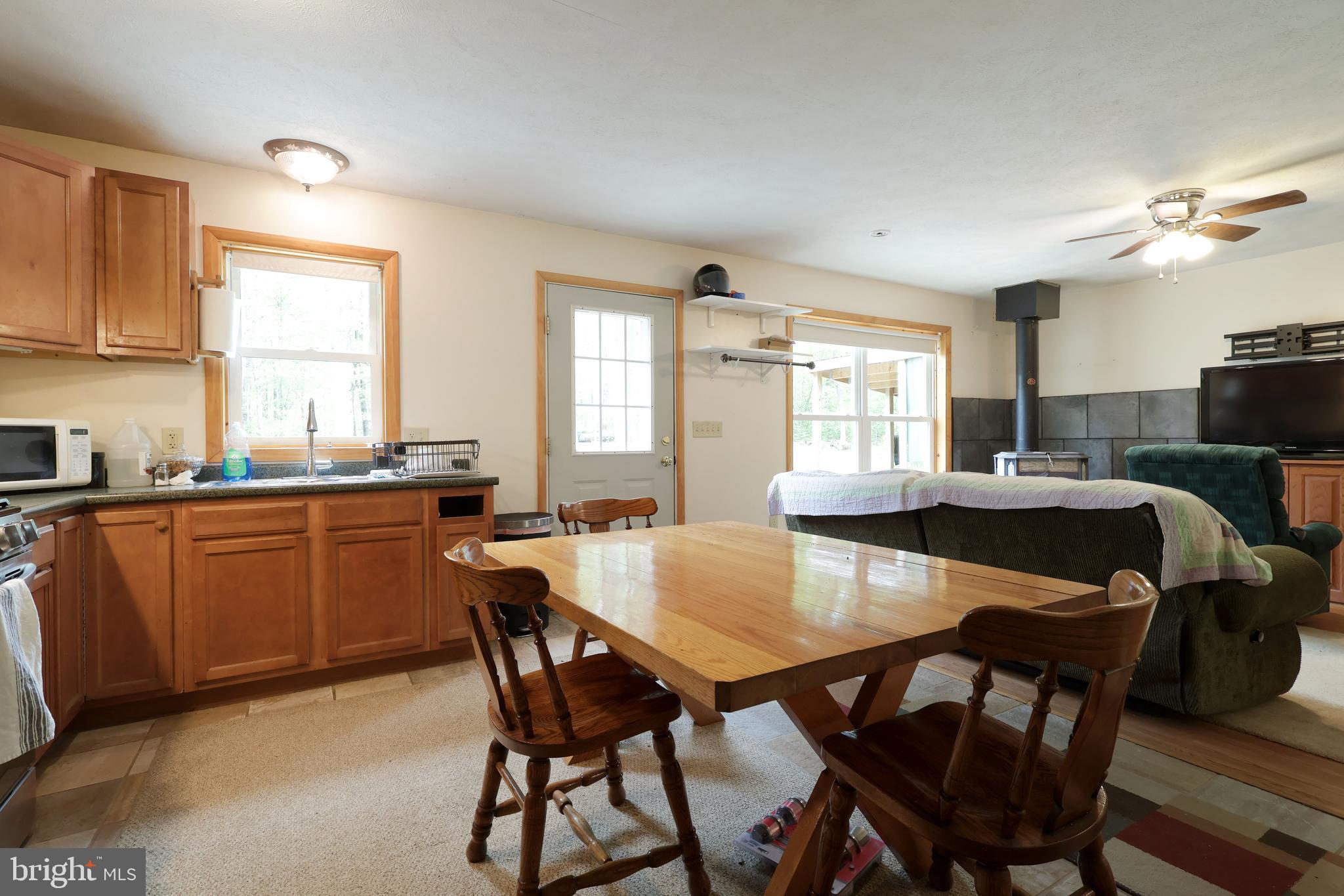 358 Buckridge Road Howard, PA 16841 - Photo 16 of 40 a kitchen with a dining table and chairs