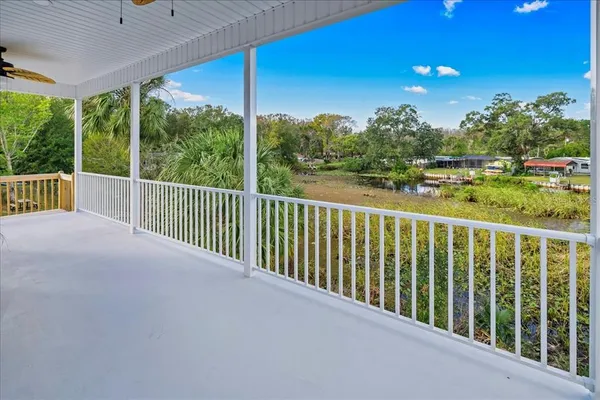 a view of a two chairs in the balcony