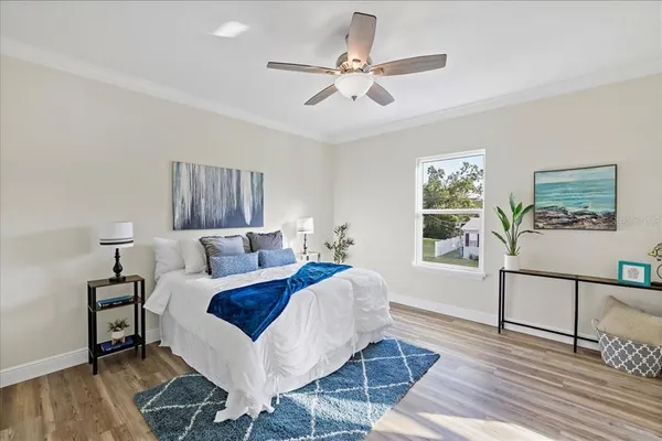 a bed room with a bed and a window