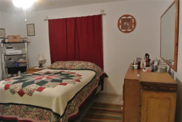 a bedroom with a bed and a closet