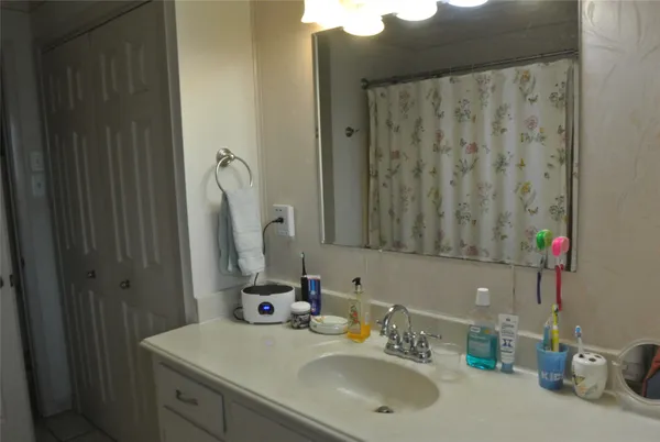a bathroom with a sink and a mirror