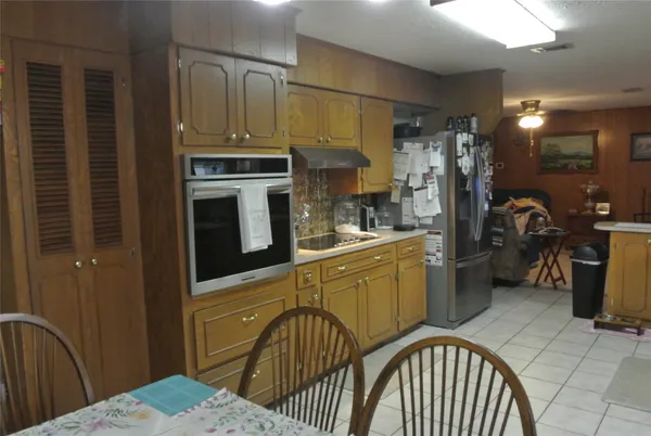 a kitchen with a sink cabinets and appliances