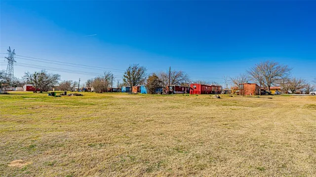 a swimming pool with outdoor seating and yard