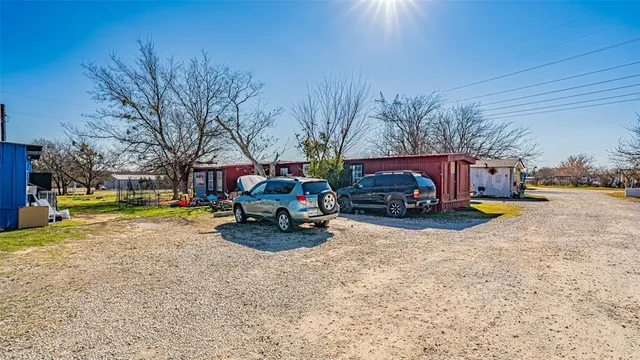 a swimming pool with outdoor seating and yard