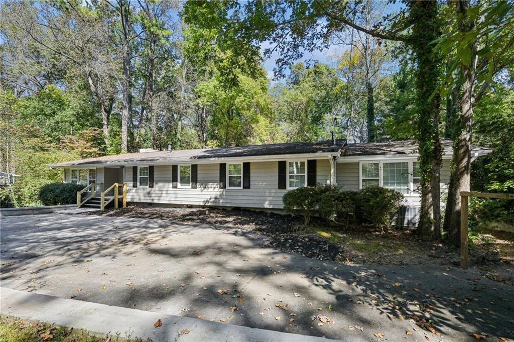 187 Old Timber Road Lawrenceville, GA 30046 - Photo 2 of 32 a front view of a house with a garden