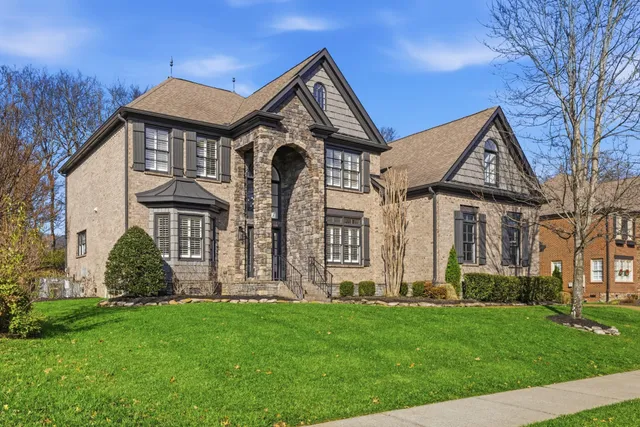 a view of a brick house with a large window