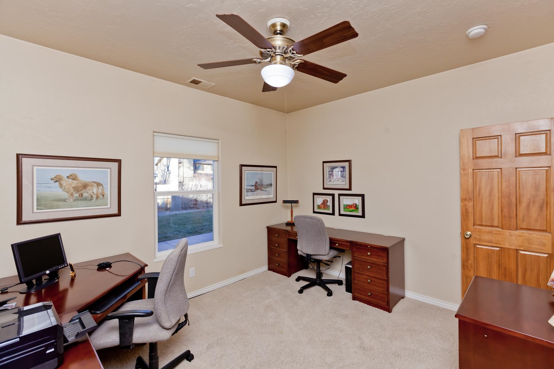 2912 El Torro Road Grand Junction, CO 81503 - Photo 25 of 34 a workspace with a desk and chair and a potted plant