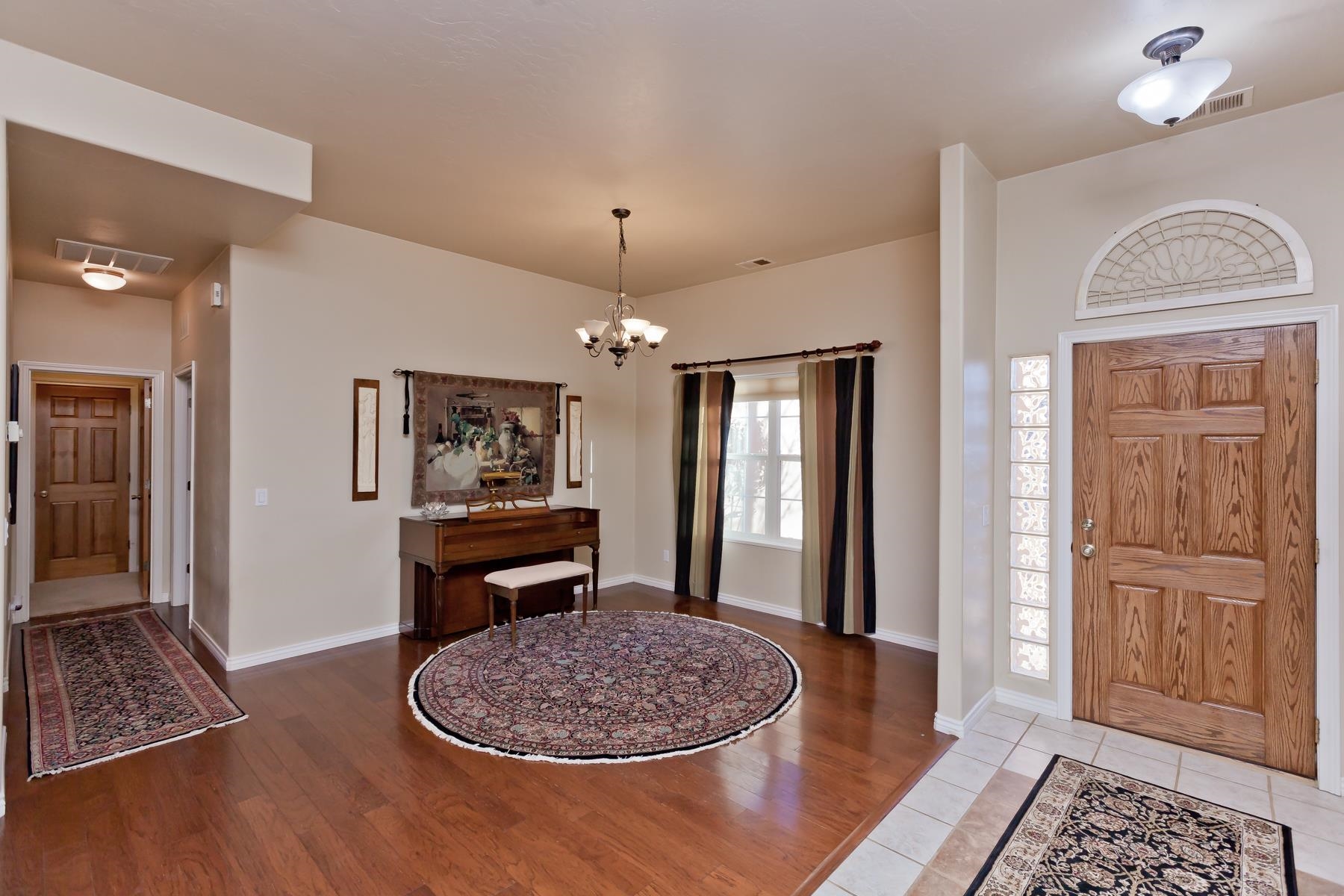 2912 El Torro Road Grand Junction, CO 81503 - Photo 3 of 34 a dining room with wooden floor and a chandelier