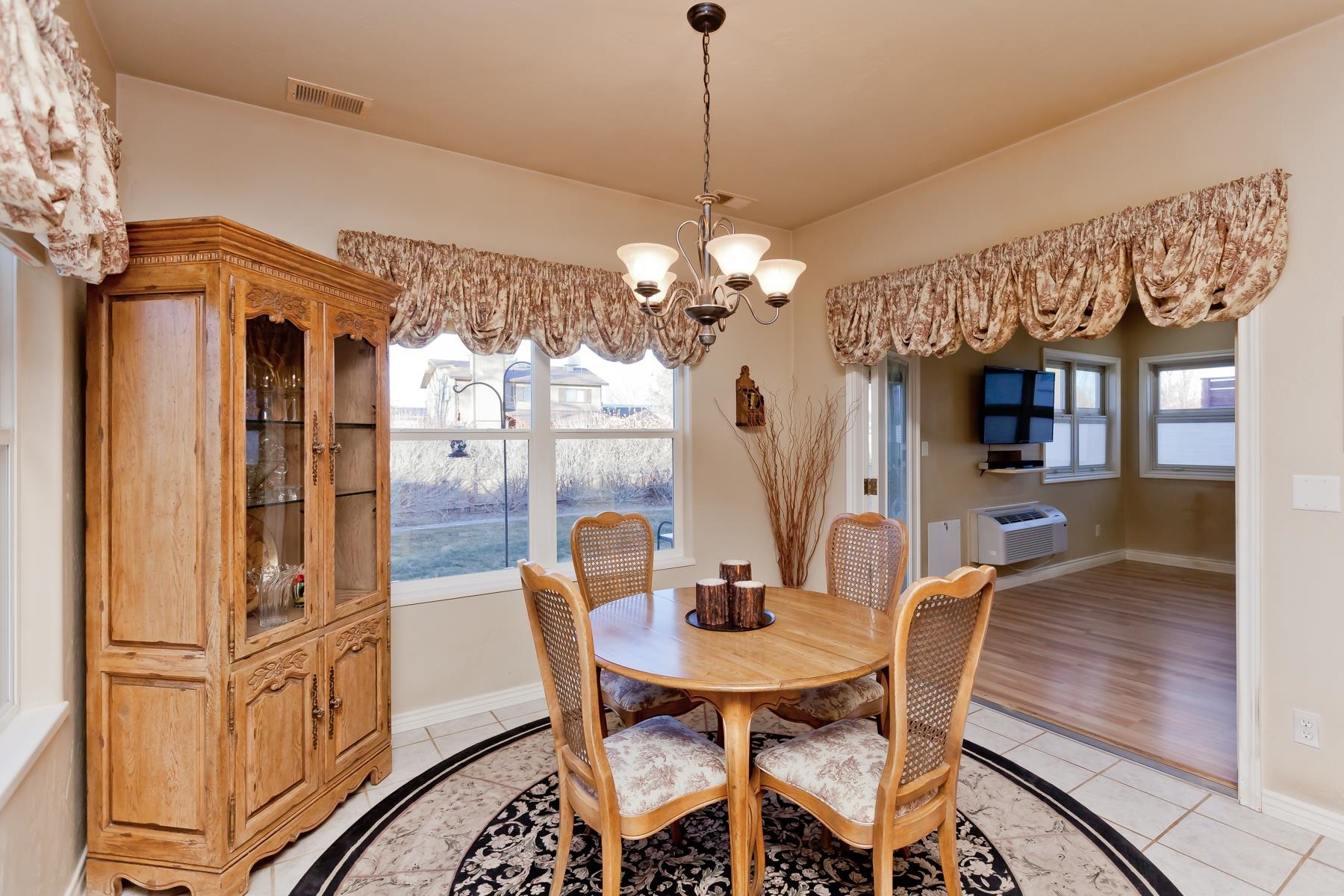 2912 El Torro Road Grand Junction, CO 81503 - Photo 8 of 34 a view of a dining room with furniture and chandelier