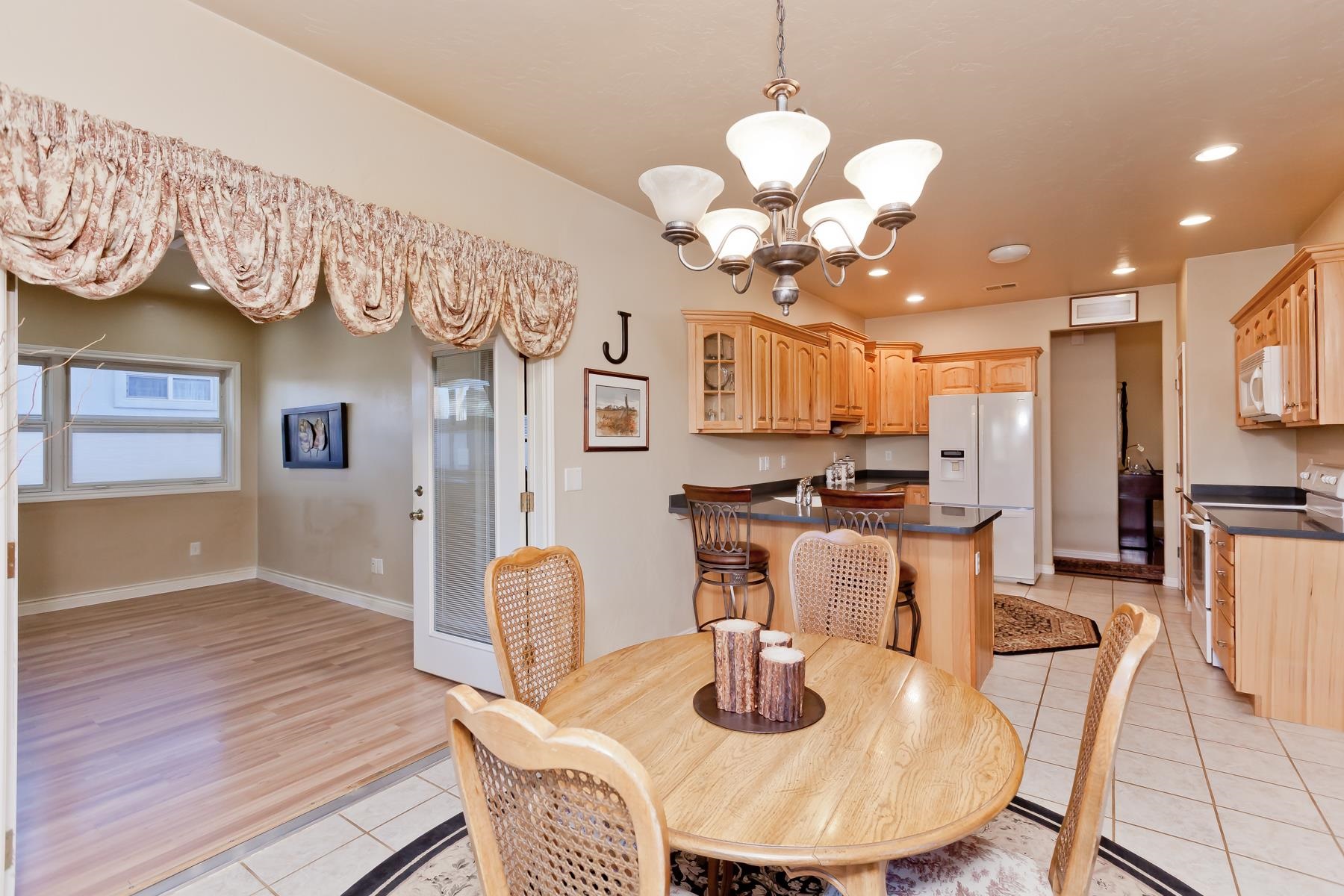 2912 El Torro Road Grand Junction, CO 81503 - Photo 9 of 34 a dining room with wooden floor furniture and kitchen view