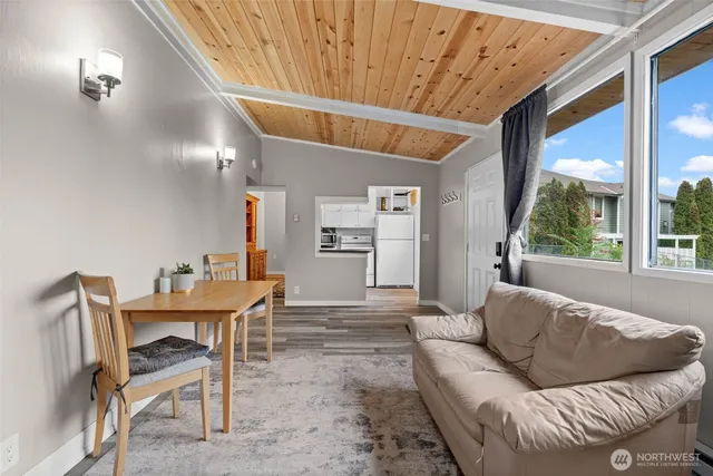 a large bed sitting in a bedroom next to a bathroom