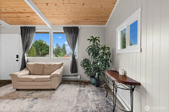 a bedroom with a bed and a potted plant